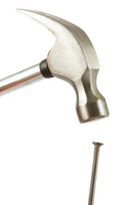 bigstock-Hammer-And-Nail-35420036.jpg